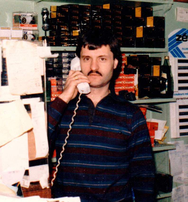 Close-up of Philip Cabbad in the original shop surrounded by premium imported cycling products