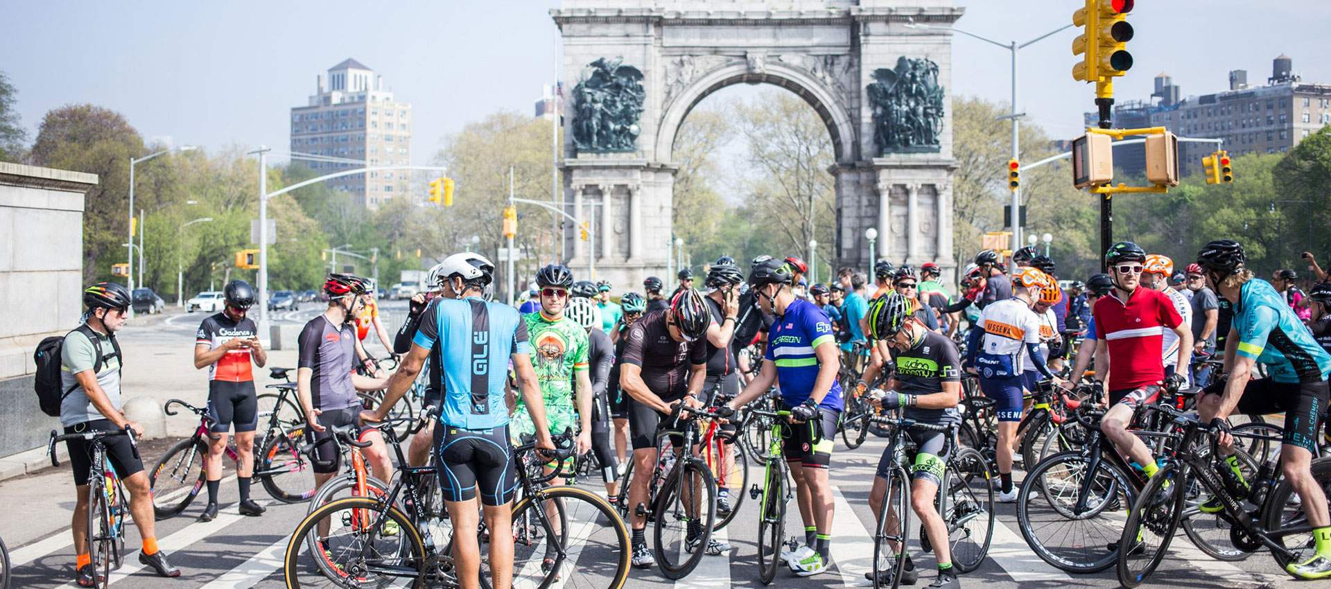 Large group of cyclists gathered at Grand Army Plaza in Brooklyn for an RA Cycles community ride